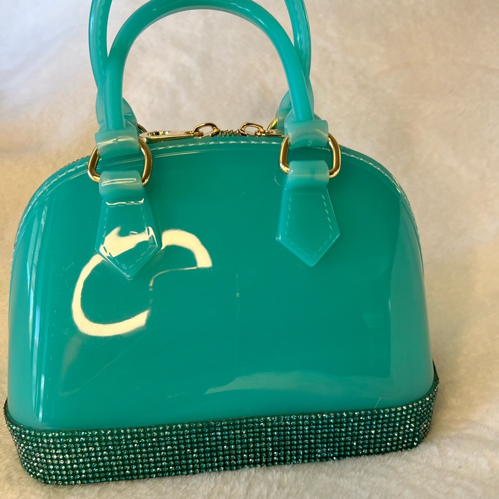 Cute jelly bag with sparkly edge! About the size of the LV Alma BB. Adorable 🥰